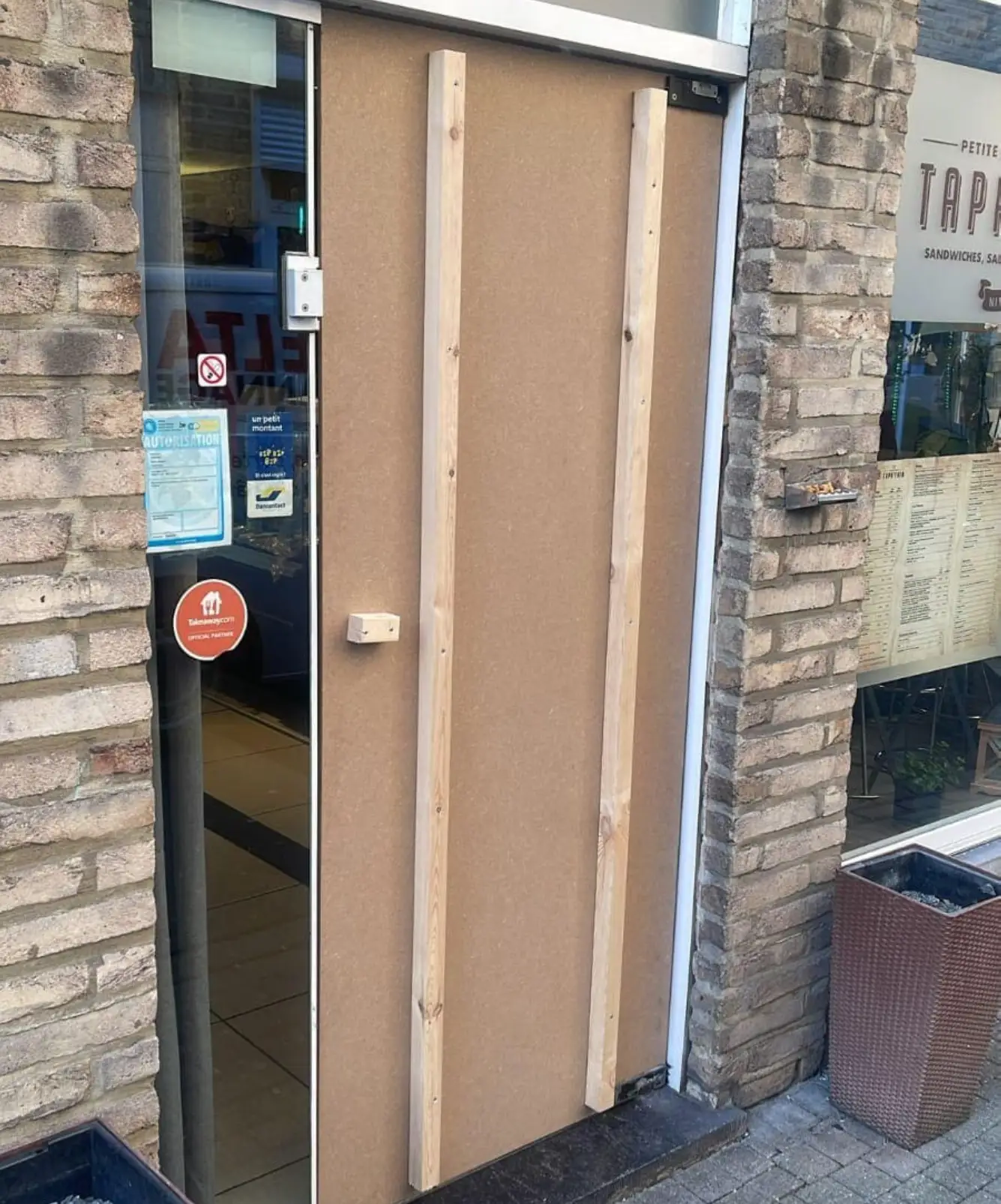 a door with glass and wood frame