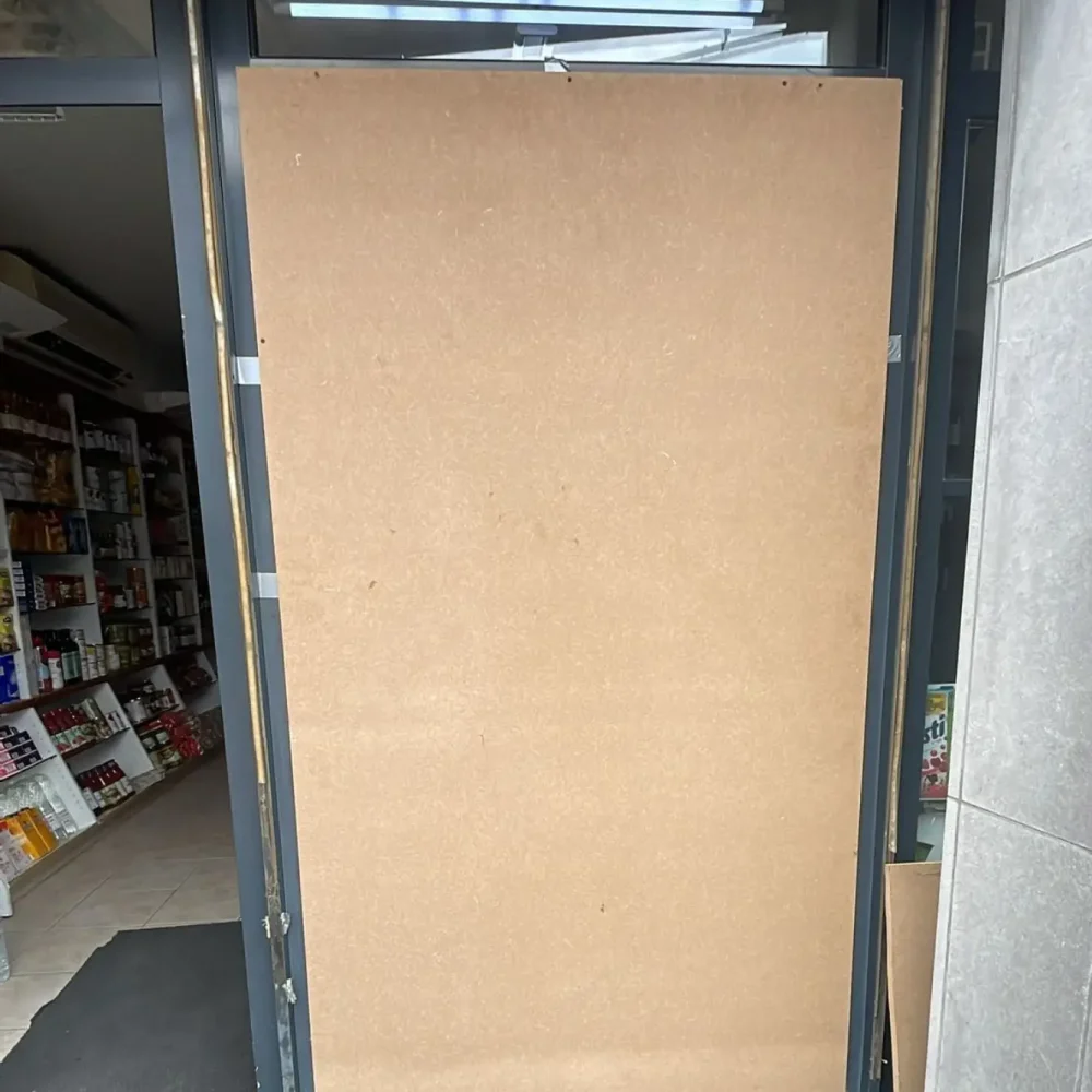 a door with a large cardboard board